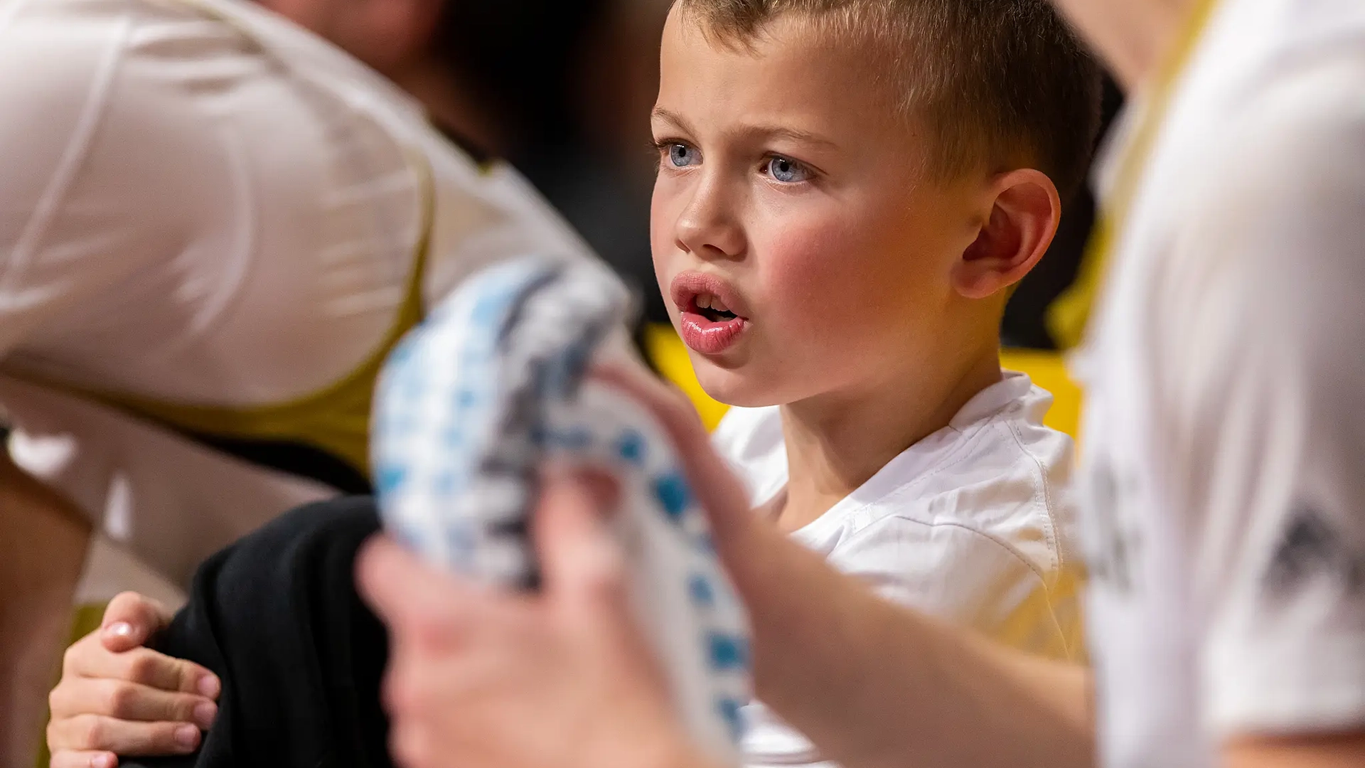 Torin on the team bench with his Oles